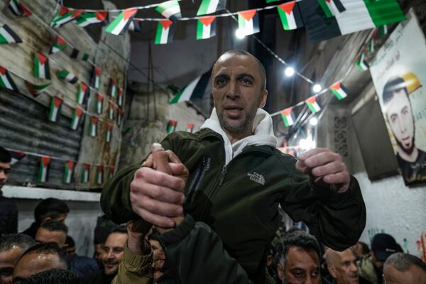 Palestinian prisoner Fahd Sawalhi, 43, is welcomed by a crowd after being released from an Israeli prison, in the West Bank refugee camp of Balata, Nablus, Saturday, Jan. 25, 2025. (AP Photo/Majdi Mohammed)