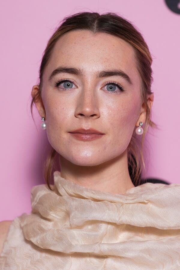 Saoirse Ronan poses for photographers upon arrival at the photo call for an 'In Conversation' event at the BFI Southbank, on Wednesday, Dec. 18, 2024, in London. (Photo by Scott A Garfitt/Invision/AP)