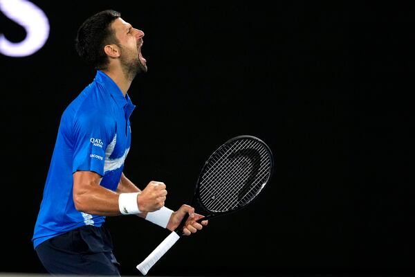 Novak Djokovic of Serbia reacts after winning the third set against Nishesh Basavareddy of the U.S. during their first round match at the Australian Open tennis championship in Melbourne, Australia, Monday, Jan. 13, 2025. (AP Photo/Asanka Brendon Ratnayake)