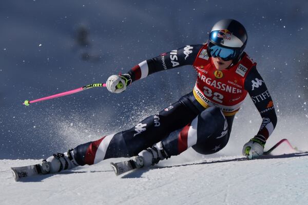 United States Lindsey Vonn speeds down the course during an alpine ski, women's World Cup downhill race, in St. Anton, Austria, Saturday, Jan. 11, 2025. (AP Photo/Marco Trovati)