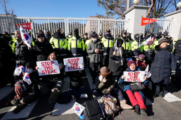 Supporters of impeached South Korean President Yoon Suk Yeol attend a rally to oppose his impeachment near the Corruption Investigation Office for High-Ranking Officials in Gwacheon, South Korea, Wednesday, Jan. 15, 2025. (AP Photo/Ahn Young-joon)