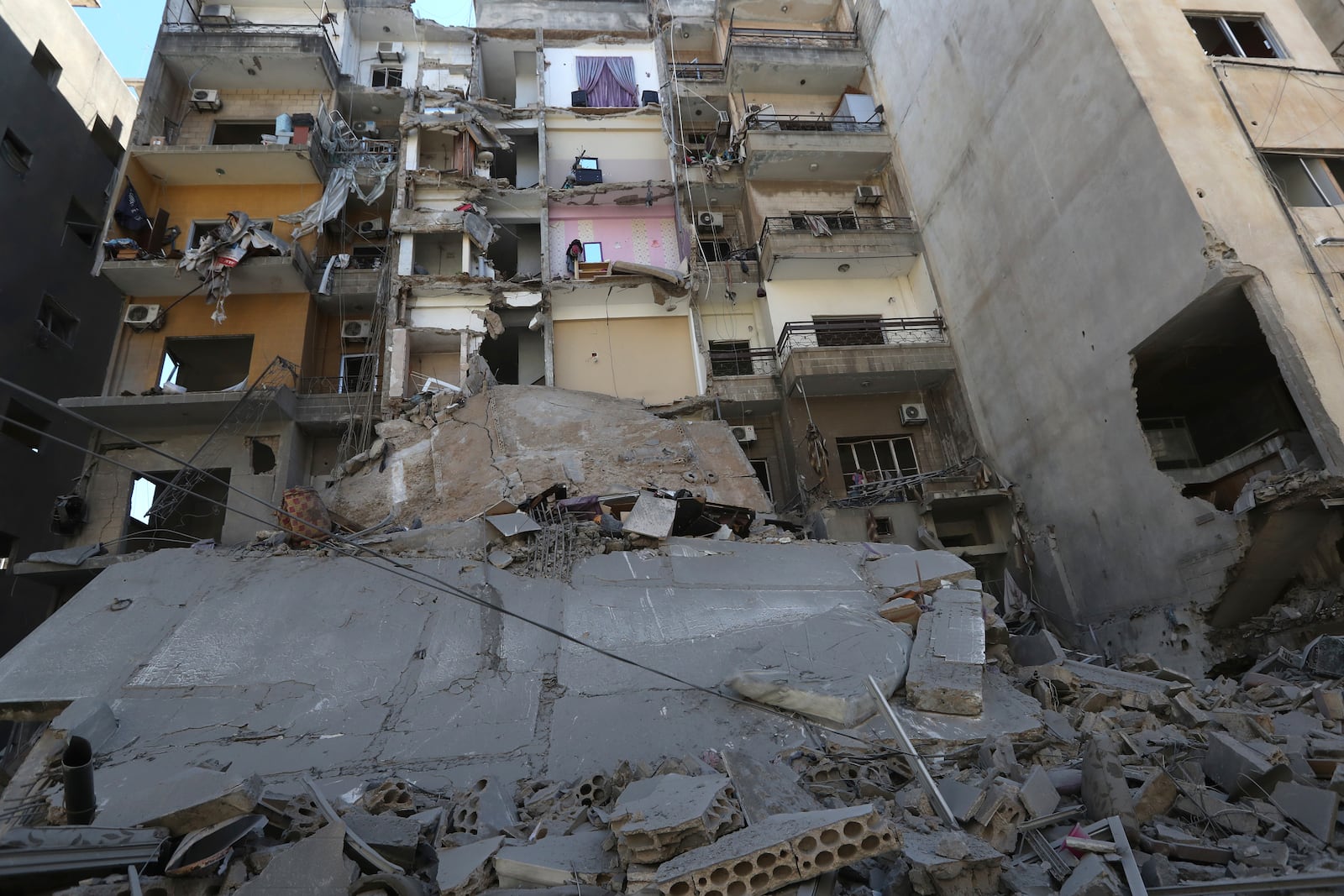 Destroyed buildings at the site that was hit by Israeli airstrikes, in Tyre, south Lebanon, Thursday, Oct. 24, 2024. (AP Photo/Mohammed Zaatari)