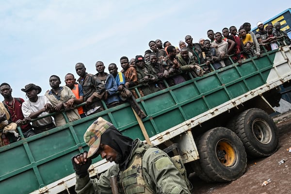 M23 rebels escort government soldiers and police who surrendered to an undisclosed location in Goma, Democratic republic of the Congo, Thursday, Jan. 30, 2025.(AP Photo/Moses Sawasawa)