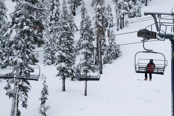 A lone skier rides on a lift Thursday, Nov. 21, 2024, at Sugar Bowl Ski Resort in Norden, Calif. (AP Photo/Brooke Hess-Homeier)