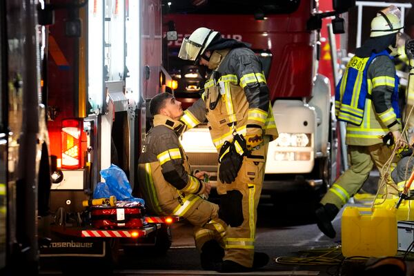 Emergency services work in a cordoned-off area near a Christmas Market, after a car drove into a crowd in Magdeburg, Germany, Friday, Dec. 20, 2024. (AP Photo/Ebrahim Noroozi)