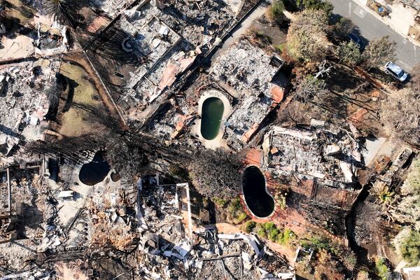 An aerial view shows the devastation left by the Palisades Fire in the Pacific Palisades section of Los Angeles, Monday, Jan. 27, 2025. (AP Photo/Jae C. Hong)