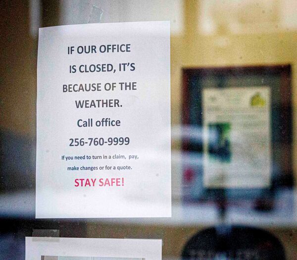 Signage warns patrons that they are closed due to weather, Friday, Jan. 10, 2025, in Florence, Ala. (Dan Busey/The TimesDaily via AP)