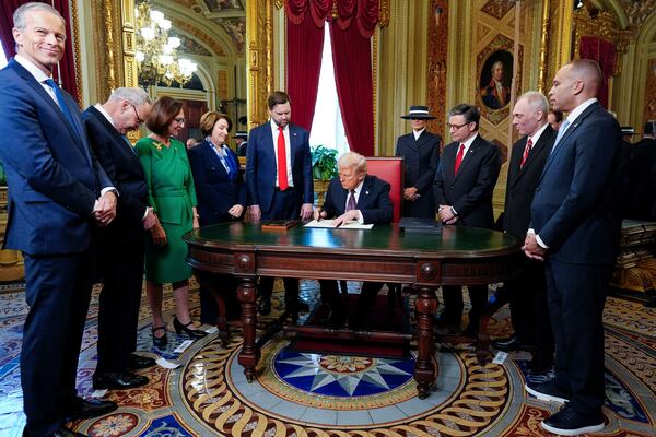 President Donald Trump, center, takes part in a signing ceremony in the President's Room after the 60th Presidential Inauguration, Monday, Jan. 20, 2025, at the U.S. Capitol in Washington. Surrounding the president are, from left, Senate Majority Leader Sen. John Thune, R-S.D.; Senate Minority Leader Chuck Schumer, D-N.Y.; Sen. Deb Fischer, R-Neb.; Sen. Amy Klobuchar, D-Minn.; Vice President JD Vance; first lady Melania Trump; House Speaker Mike Johnson, R-La.; House Majority Leader Steve Scalise, R-La.; and House Minority Leader Hakeem Jeffries, D-N.Y. (Melina Mara/The Washington Post via AP, Pool)