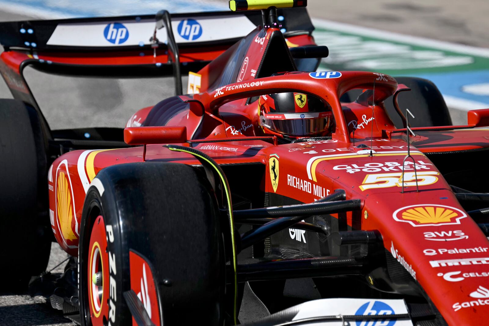 Ferrari driver Carlos Sainz, of Spain, exits pit row during the F1 U.S. Grand Prix auto race at the Circuit of the Americas, Sunday, Oct. 20, 2024, in Austin, Texas. (Patrick Fallon/Pool Photo via AP)