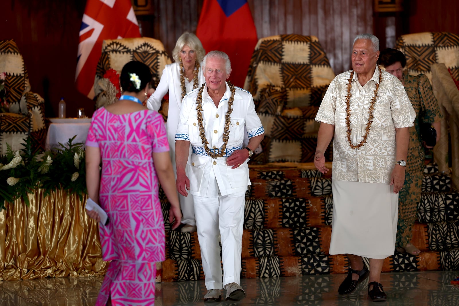 Britain's King Charles III, center, and Queen Camilla, second left, meet with Head of State of the Independent State of Samoa Tuimaleali'ifano Va'aleto'a Sualauvi II, right, during a welcome ceremony at the National University of Samoa in Apia, Thursday, Oct. 24, 2024. (Manaui Faulalo/Pool Photo via AP)