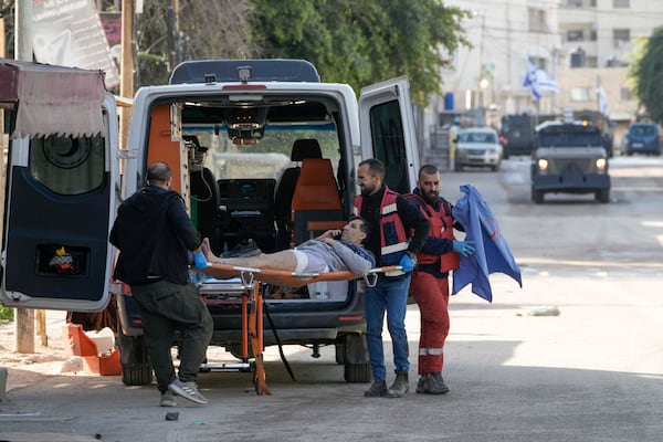 Medics evacuate a wounded man during an Israeli military operation in the West Bank city of Jenin, Tuesday, Jan. 21, 2025. (AP Photo/Majdi Mohammed).