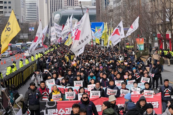 Protesters march to the presidential office after a rally demanding South Korean President Yoon Suk Yeol's impeachment in Seoul, South Korea, Thursday, Dec. 12, 2024. (AP Photo/Ahn Young-joon)