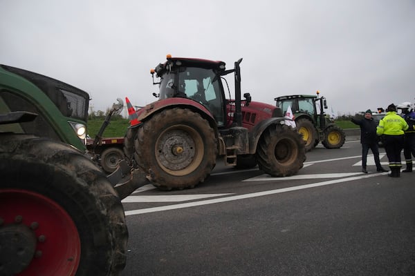 Farmers block a speedway to protest the EU-Mercosur trade agreement, Monday, Nov. 18, 2024 in Velizy-Villacoublay outside Paris. (AP Photo/Christophe Ena)