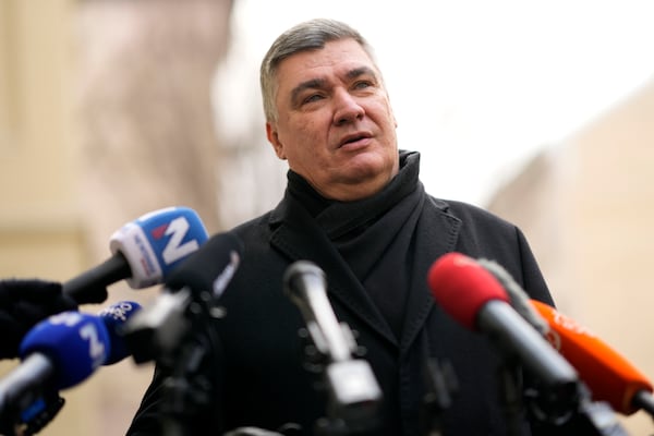 President incumbent Zoran Milanovic talks to media after casting his ballot during a runoff vote for the Croatian presidential election at a polling station in Zagreb, Croatia, Sunday, Jan. 12, 2025. (AP Photo/Darko Bandic)