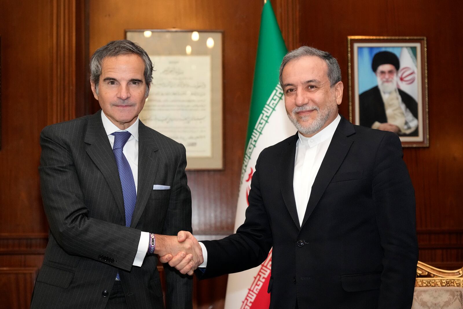 International Atomic Energy Agency (IAEA) Director General Rafael Mariano Grossi, left, shakes hands with Iranian Foreign Minister Abbas Araghchi during their meeting in Tehran, Iran, Thursday, Nov. 14, 2024. (AP Photo/Vahid Salemi)