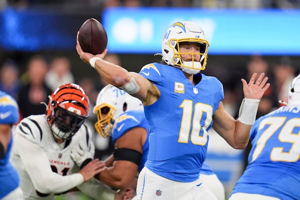 Los Angeles Chargers quarterback Justin Herbert (10) throws a pass during the first half of an NFL football game against the Cincinnati Bengals, Sunday, Nov. 17, 2024, in Inglewood, Calif. (AP Photo/Gregory Bull)