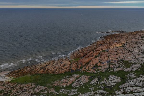 Waves from Hudson Bay crash onto shore, Wednesday, Aug. 7, 2024, in Churchill, Manitoba. (AP Photo/Joshua A. Bickel)