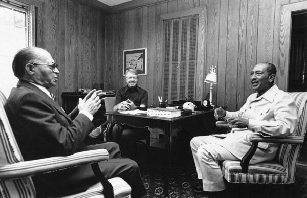 FILE - In this Official White House photo, Israeli Prime Minister Menachem Begin, left, President Jimmy Carter, center, and Egyptian President Anwar Sadat begin their second day of peace talks at Camp David, Md., on Sept. 7, 1978. (AP Photo/Official White House Photo, File)