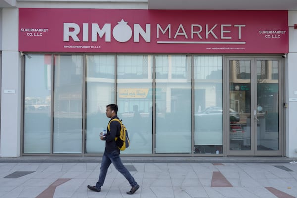 A man walks past Rimon Market, a Kosher grocery store managed by the late Rabbi Zvi Kogan, in Dubai, United Arab Emirates, Sunday, Nov. 24, 2024. (AP Photo/Jon Gambrell)