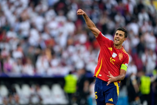 FILE - Spain's Rodri celebrates after a quarterfinal match between Germany and Spain at the Euro 2024 soccer tournament in Stuttgart, Germany, Friday, July 5, 2024. (AP Photo/Antonio Calanni, File)