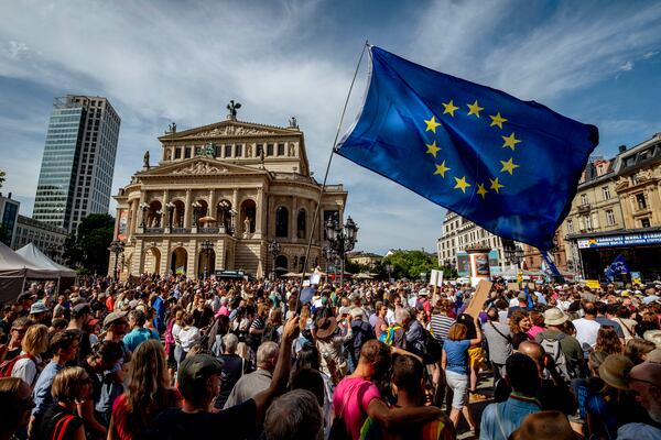 People take part in a demonstration for voting at the European election and against far right on the square in front of the Old Opera in Frankfurt, Germany, Saturday, June 8, 2024. Nearly 400 million European Union citizens have been going to polls this week to elect members of the European Parliament, or MEPs, in one of the biggest global democratic events. (AP Photo/Michael Probst)