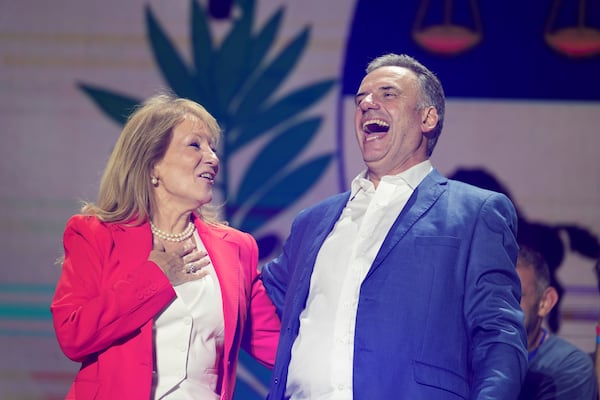 Yamandu Orsi, candidate for the Broad Front (Frente Amplio), and running mate Carolina Cosse, left, celebrate their victory in the presidential run-off election in Montevideo, Uruguay, Sunday, Nov. 24, 2024. (AP Photo/Natacha Pisarenko)