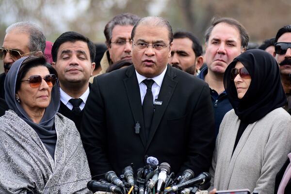 Pakistan's already-imprisoned former Prime Minister Imran Khan's legal team member Salman Sardar, flanked by Khan's sisters Uzma Khanum, right and Aleema Khan, left, talks to media after a court verdict on corruption case against Khan at outside Adiala prison, in Rawalpindi, Pakistan, Friday, Jan. 17, 2025. (AP Photo/W.K. Yousufzai)