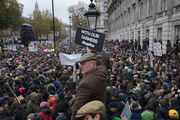 The National Farmers' Union members attend a protest against the planned changes to tax rules, in London, Tuesday, Nov. 19, 2024. (AP Photo/Kin Cheung)