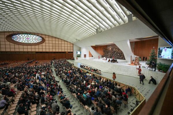 Pope Francis exchanges the season's greetings with Vatican employees, in the Paul VI Hall at the Vatican, Saturday, Dec. 21, 2024. (AP Photo/Andrew Medichini)