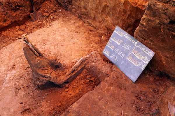 FILE - Half-buried skeletal remains poke out of the Specialized Anti-Riot Group barracks of the National Police in Asuncion, Paraguay, November 9, 2011. (AP photo/Jorge Saenz, File)