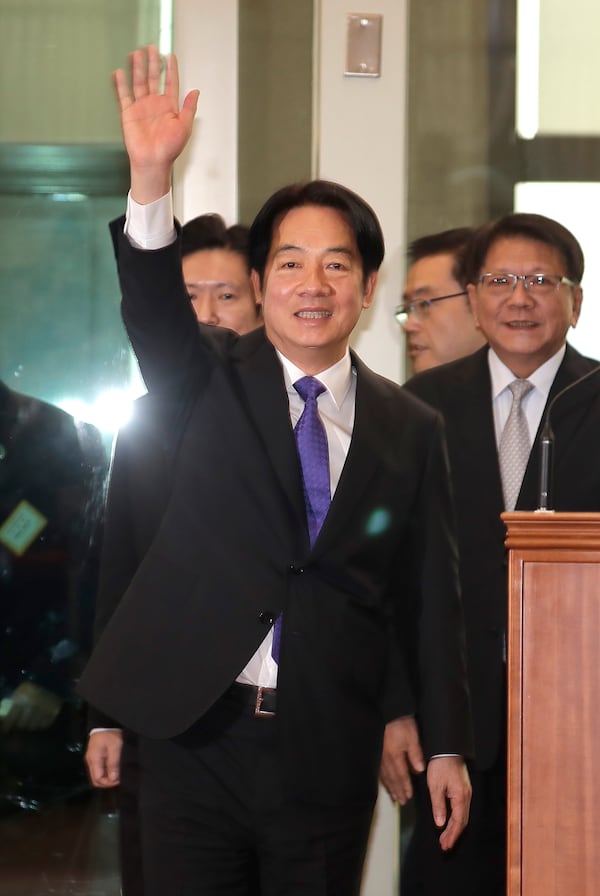 Taiwanese President Lai Ching-te waves to the media as he departs for South Pacific at Taoyuan International Airport in Taoyuan, Taiwan, Saturday, Nov. 30, 2024. Lai leave Taiwan on Saturday on a weeklong trip to visit the Marshall Islands, Tuvalu and Palau 'X three diplomatic allies of the self-governed island. (AP Photo/Chiang Ying-ying)