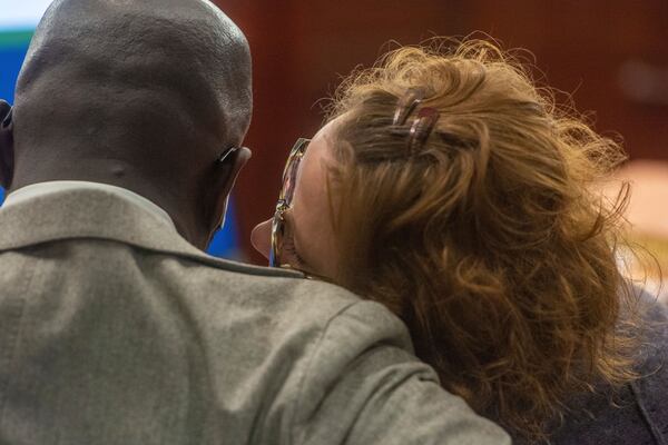 Former District Attorney Jackie Johnson, right, confers with one of her defense attorneys, Keith Adams, in court Tuesday, Jan. 21, 2025, as jury selection began in her misconduct trial. Johnson is charged with interfering with police investigating the 2020 killing of Ahmaud Arbery. (Michael Hall/The Brunswick News via AP, Pool)