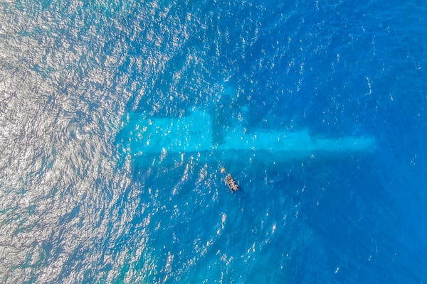 FILE - In this photo provided by the New Zealand Defence Force, divers survey the area around HMNZS Manawanui on the southern coast of Upulo, Samoa, after the Manawanui ran aground and sank on Oct. 6. (AC Jese Somerville/New Zealand Defence Force via AP,File)