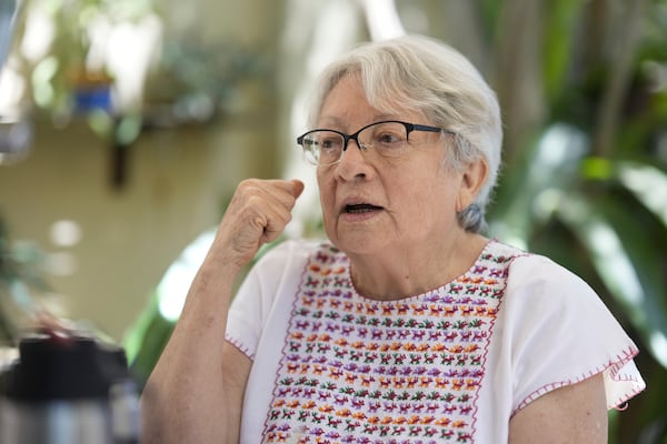 Rosa Maria Ortiz gives an interview in Asuncion, Paraguay, Tuesday, Oct. 29, 2024. Ortiz said she used to visit the city's main detention center to see who was being held and would lie to the chief officer that the bishop had sent her. (AP Photo/Jorge Saenz)