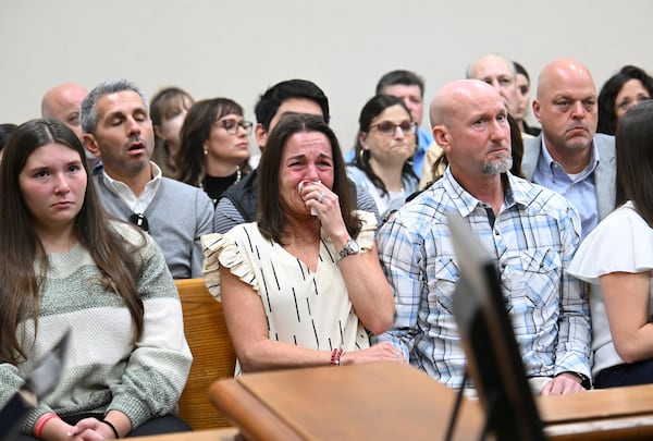 Allyson Phillips, second from left, mother of Jose Ibarra, accused of killing a Georgia nursing student earlier this year, reacts as John Phillips, stepfather of Jose Ibarra, comforts her during a trial of Jose Ibarra at Athens-Clarke County Superior Court, Friday, Nov. 15, 2024, in Athens, Ga. (Hyosub Shin/Atlanta Journal-Constitution via AP, Pool)