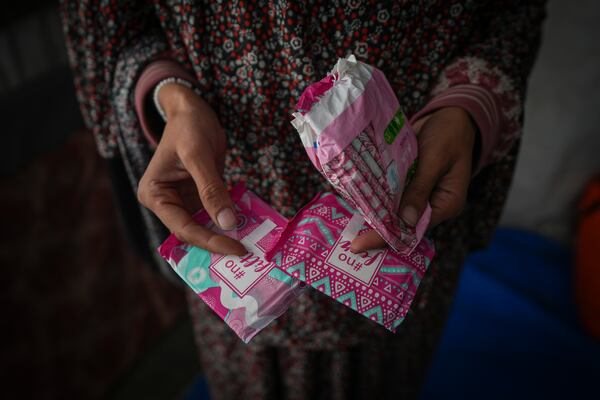 Wafaa Nasrallah shows her sanitary pads at her tent in a camp for displaced Palestinians in Deir al-Balah, Gaza Strip, Saturday Dec. 28, 2024. Nasrallah, a displaced mother of two, says life in the camps makes even the simplest needs difficult, like getting period pads, which she can hardly afford.(AP Photo/Abdel Kareem Hana)