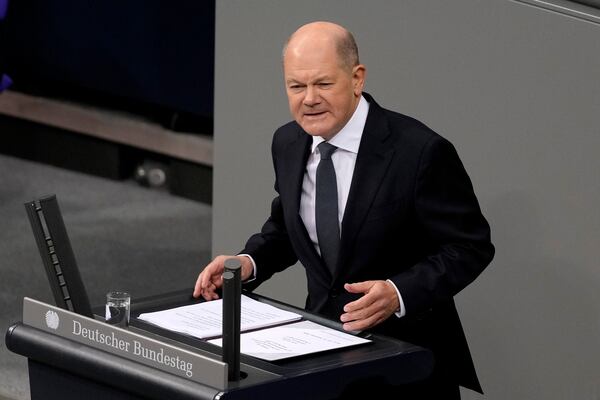 FILE - German Chancellor Olaf Scholz speaks during a plenary session at the German parliament Bundestag where he faces a vote of confidence, in Berlin, Dec. 16, 2024. (AP Photo/Markus Schreiber, File)