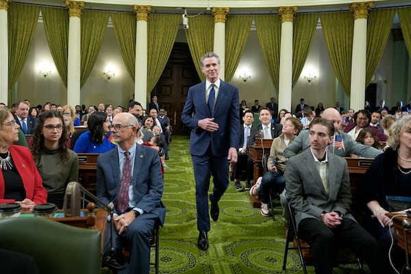 California Gov. Gavin Newsom walks to the dais of the State Assembly during the assembly's Organizational Session in Sacramento, Calif., Monday, Dec. 2, 2024. (AP Photo/Rich Pedroncelli Pool)