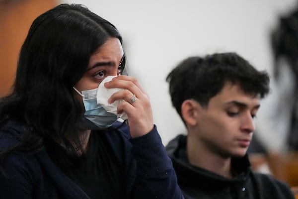 Leila Vega wipes tears during a vigil for students that were killed and injured in a school shooting Wednesday, Jan. 22, 2025, in Nashville, Tenn. (AP Photo/George Walker IV)