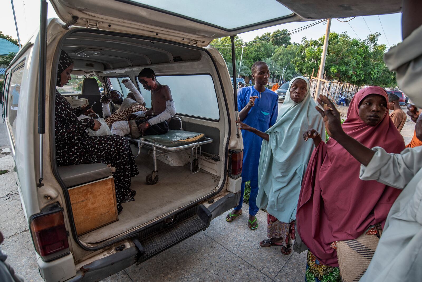 Victims of a tanker explosion from Majiya town receive treatment inside an ambulance at the Aminu Kano teaching hospital in Kano Nigeria, Wednesday, Oct. 16, 2024. (AP Photo/Sani Maikatanga)