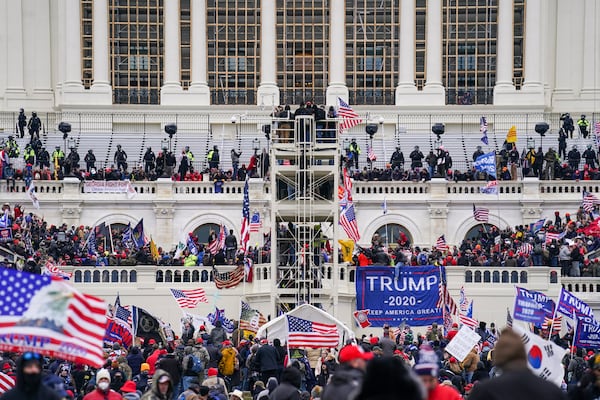 FILE - Insurrectionists loyal to President Donald Trump breach the Capitol in Washington, Jan. 6, 2021. (AP Photo/John Minchillo, File)