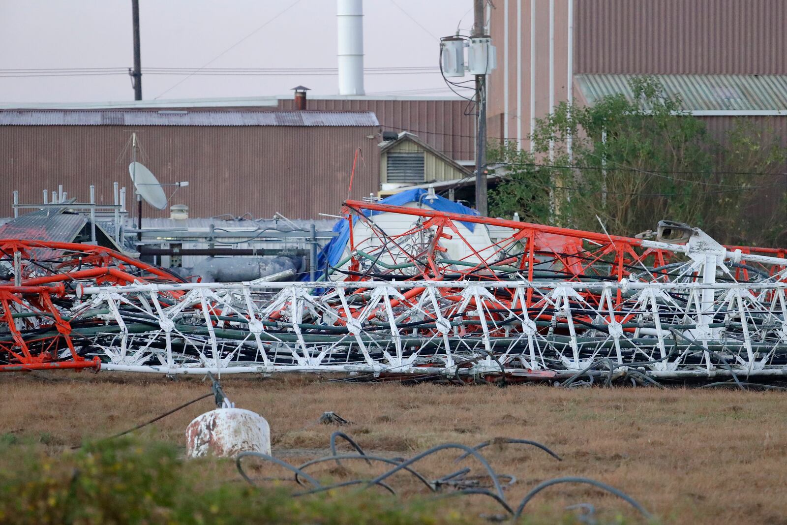 A view from the north side of the collapsed radio tower where a helicopter collided with the structure, killing all aboard Monday, Oct. 21, 2024 in Houston. (Michael Wyke/Houston Chronicle via AP)