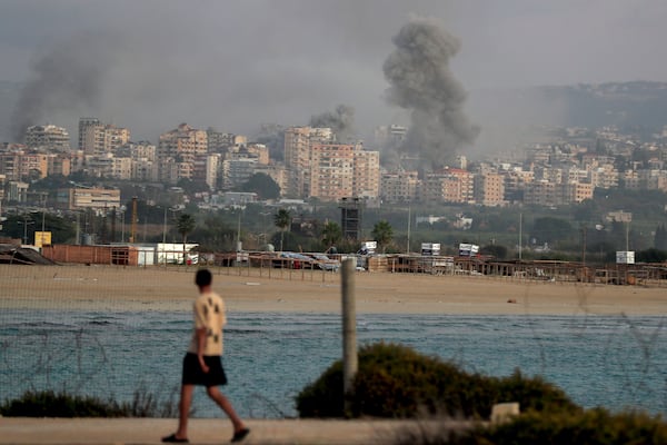 Smokes rise from buildings hit in Israeli airstrikes in Tyre, southern Lebanon, Saturday, Nov. 16, 2024. (AP Photo/Mohammed Zaatari)