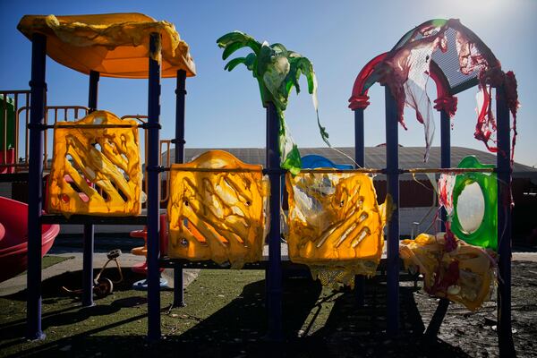 FILE - A jungle gym melted and destroyed by the Eaton Fire is seen at a school, Jan. 15, 2025, in Altadena, Calif. (AP Photo/John Locher, File)