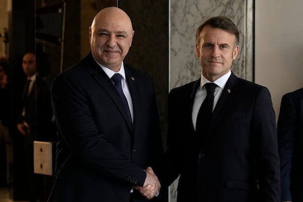 Lebanese President Joseph Aoun, left, welcomes French President Emmanuel Macron upon his arrival at the presidential palace in Baabda, in east of Beirut, Lebanon, Friday, Jan. 17, 2025. (AP Photo/Bilal Hussein)