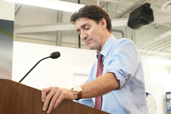 Prime Minister Justin Trudeau attends an announcement regarding a two month suspension of GST on selected goods, at Vince's Market, a grocery store in Sharon, Ontario, on Thursday Nov. 21, 2024. (Chris Young/The Canadian Press via AP)