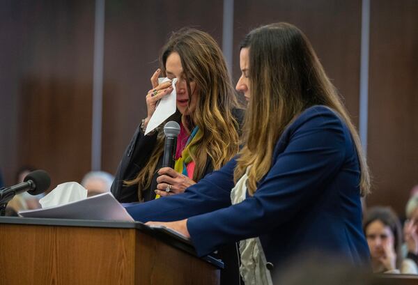 Jeanne Pepper, left, mother of Blaze Bernstein, wipes away tears as she gives a victim impact statement in court in Santa Ana, Calif., Friday, Nov. 15, 2024, prior to sentencing of Samuel Woodward, who was convicted of a hate crime murder for the killing of former classmate Blaze Bernstein. Senior Deputy District Attorney Jennifer Walker stands at right. (Mark Rightmire/The Orange County Register via AP, Pool)