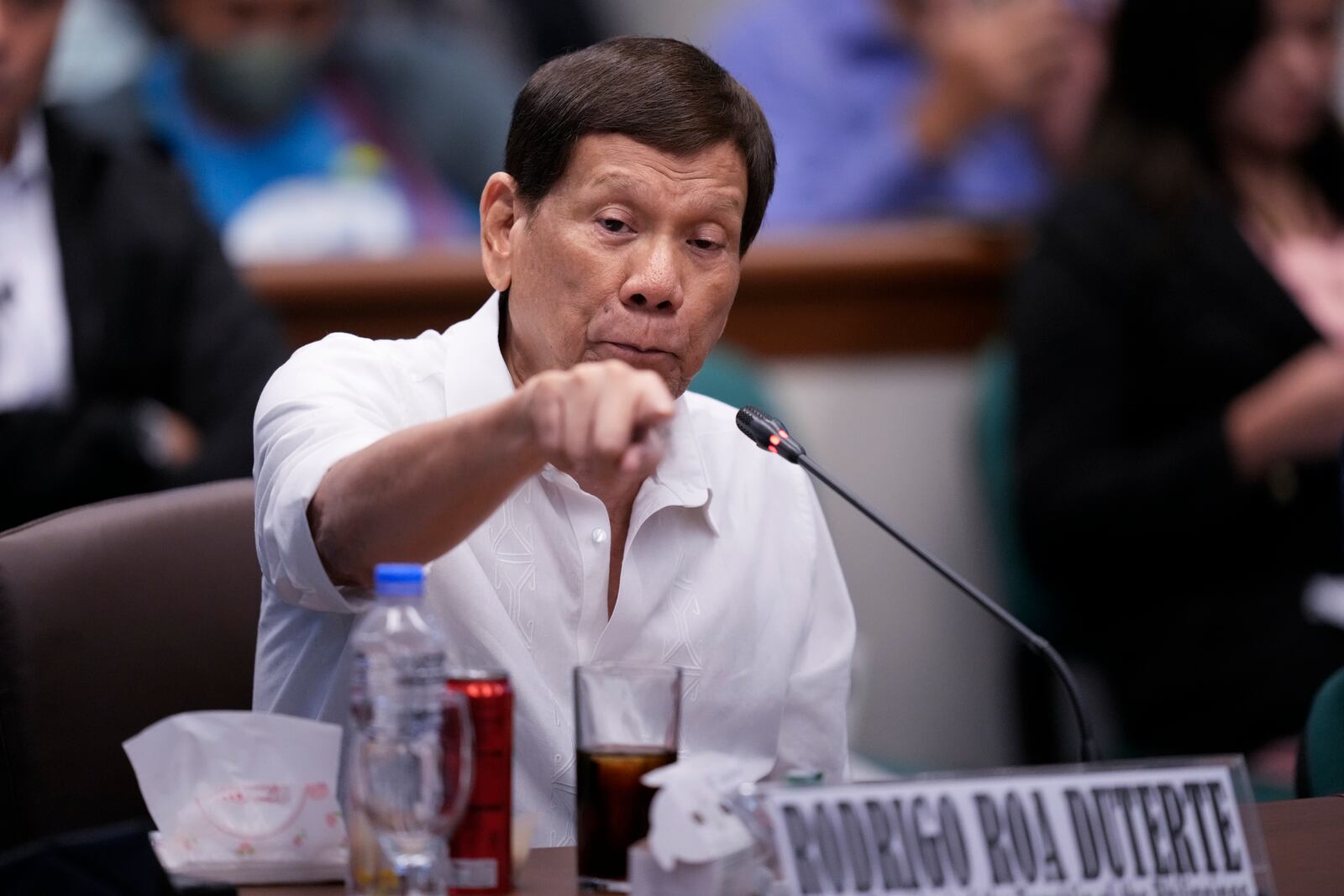 Former Philippine President Rodrigo Duterte gestures during a senate investigation on the war on the drugs during his administration, at the Philippine Senate, Monday, Oct. 28, 2024, in Manila, Philippines. (AP Photo/Aaron Favila)