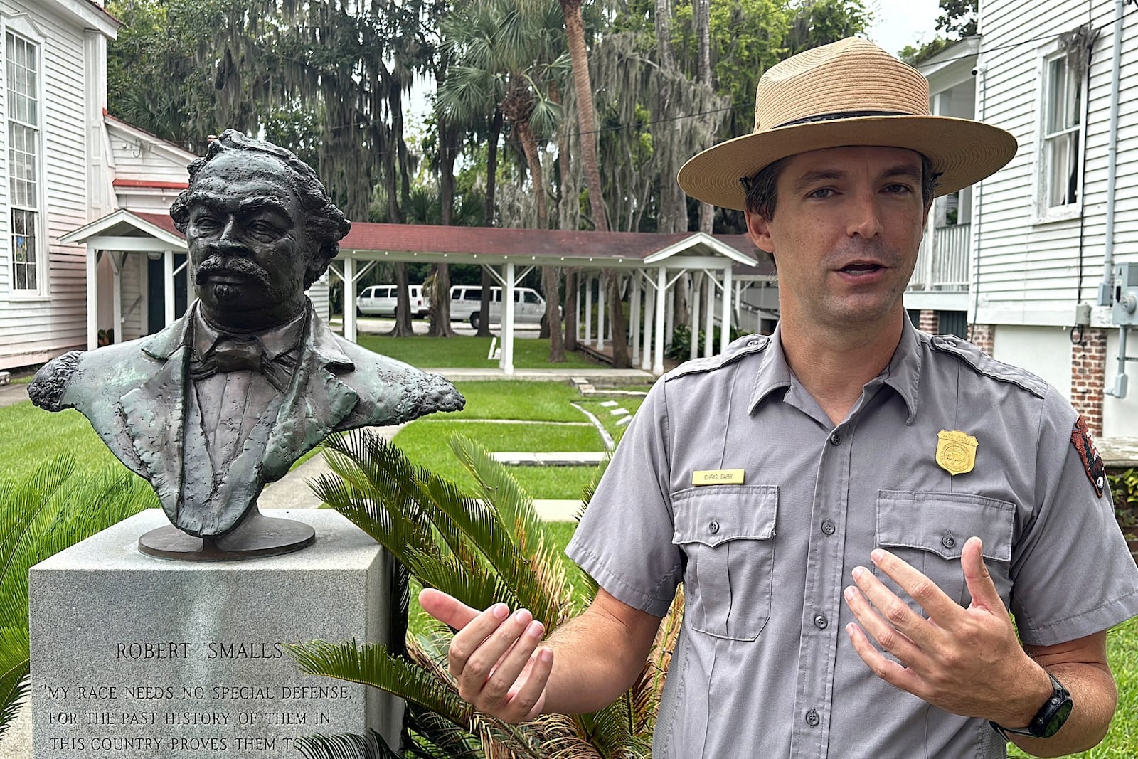 Chris Barr, a ranger at Reconstruction Era National Historic Park, talks about Robert Smalls' life beside a bust of the man who will soon be the first African American individual with a statue at the South Carolina Statehouse, Thursday, Sept. 12, 2024, in Beaufort, S.C. (AP Photo/Jeffrey Collins)