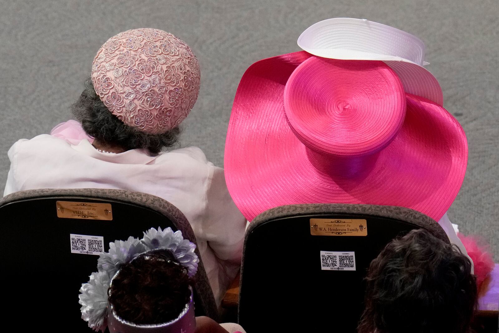 Attendees listen during a church service at New Birth Baptist Church before Democratic presidential nominee Vice President Kamala Harris speaks in Stonecrest, Ga., Sunday, Oct. 20, 2024. (AP Photo/Jacquelyn Martin)